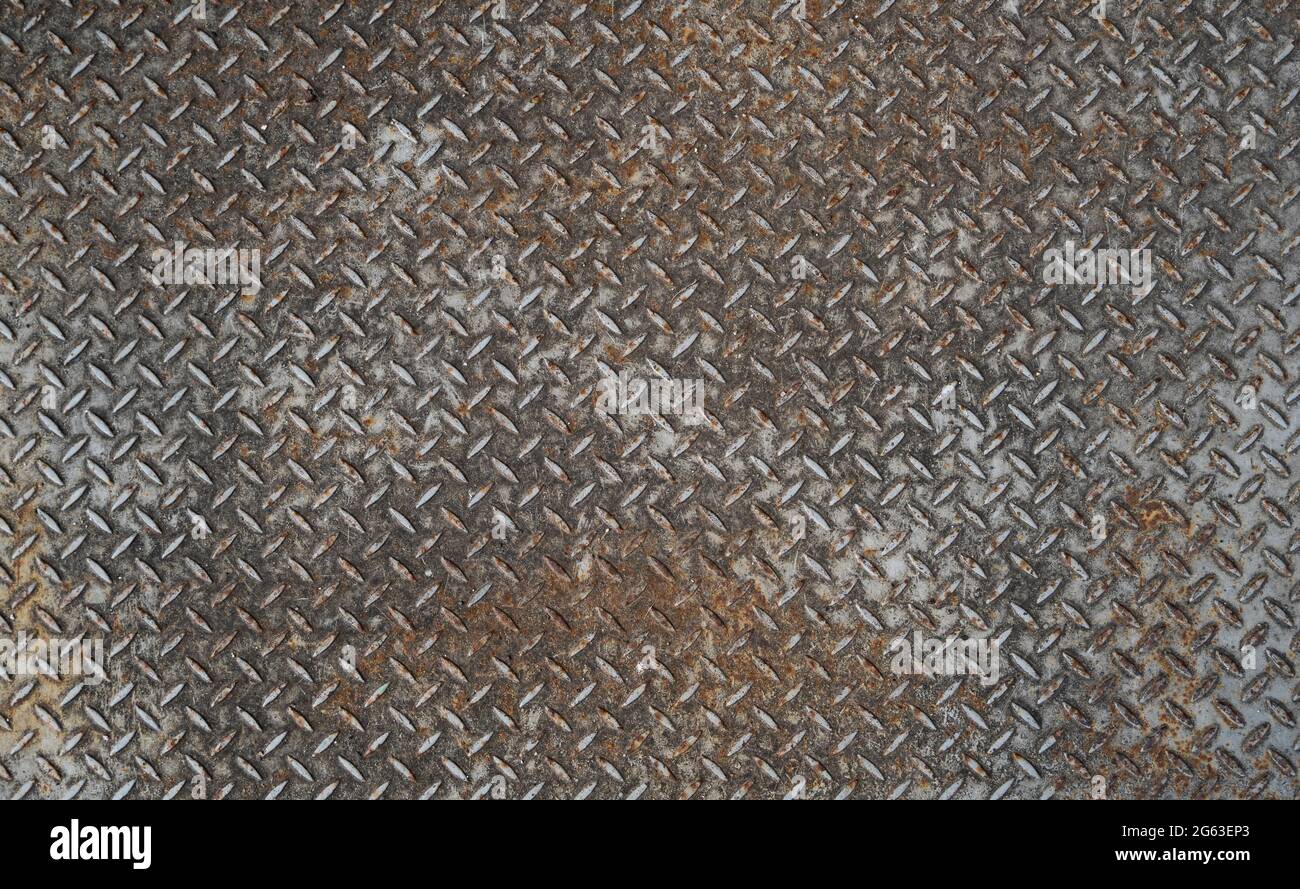 Texture de la plaque métallique rouillée du sol. Banque D'Images