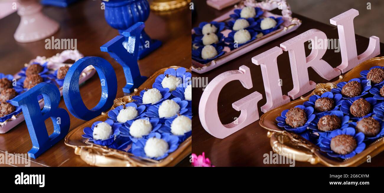 Lettres avec des mots GARÇON et FILLE à la fête de thé de révélation - le sexe de bébé révéler le concept de partie Banque D'Images