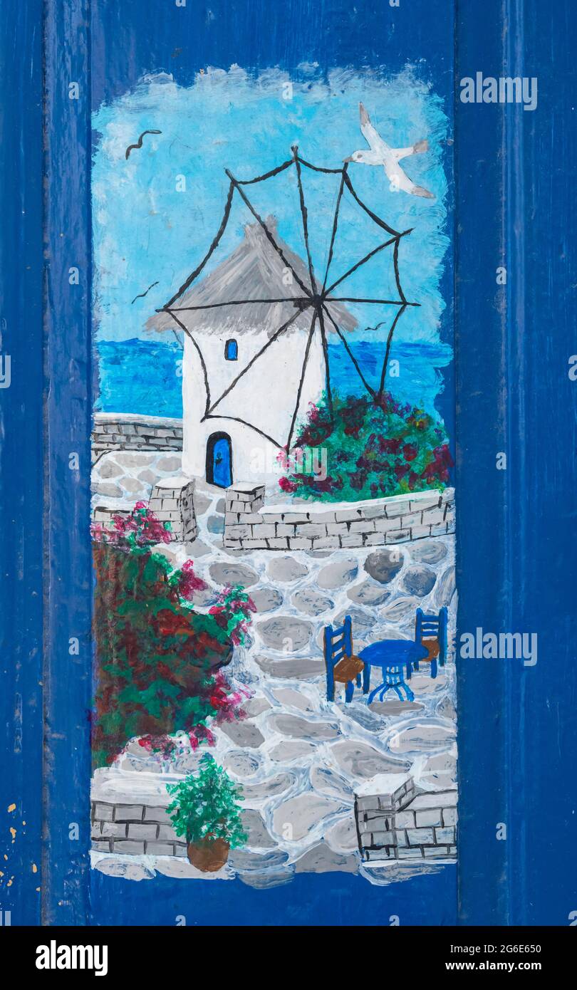 Peinture sur un mur de maison, motif grec avec mer et moulin à vent Banque D'Images