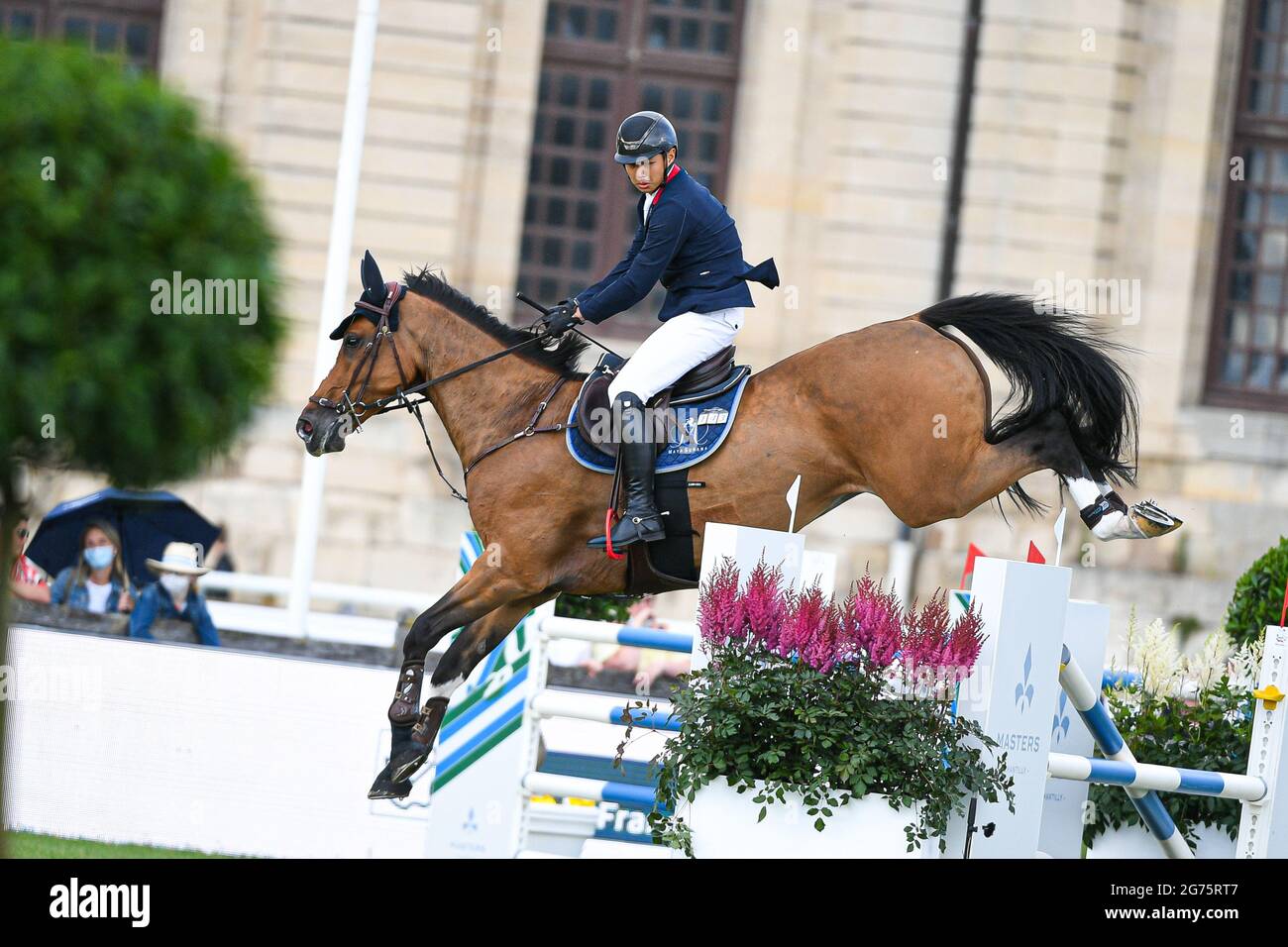 Kenneth Cheng de Honk Kong circonscription elle DoradoÂ pendant la M1 Ducatio Â Table A contre l'horloge 1m50 avec saut, des maîtres Chantilly 2021, FEI équestrian event, saut CSI5 le 10 juillet 2021 au Château de Chantilly à Chantilly, France - photo Victor Joly / DPPI Banque D'Images