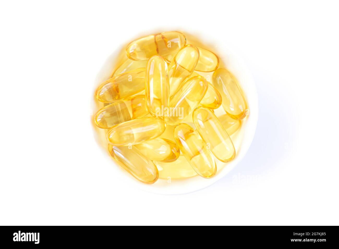 Bol de foie de morue ou capsules d'huile de poisson avec oméga 3, suppléments pour aider votre santé vue du dessus Banque D'Images