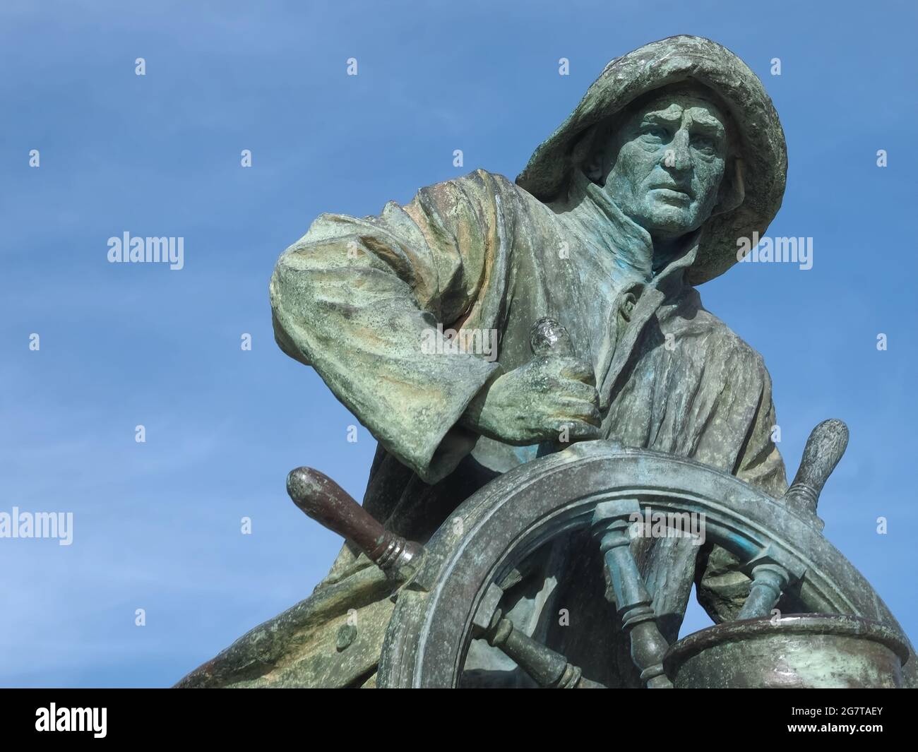 Statue en bronze d'un marin avec une roue Banque D'Images
