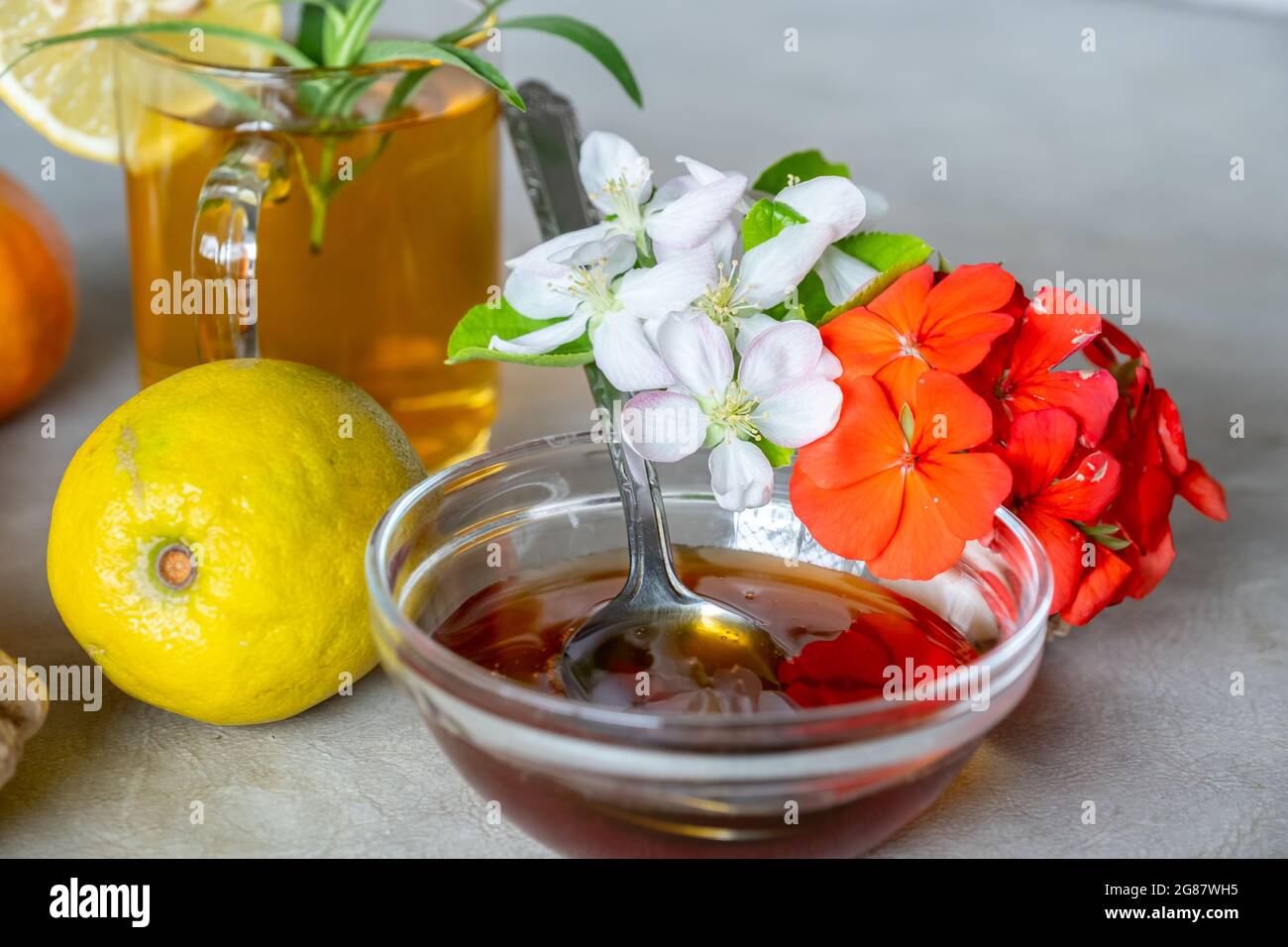 Miel naturel aux roses et aux agrumes Banque D'Images