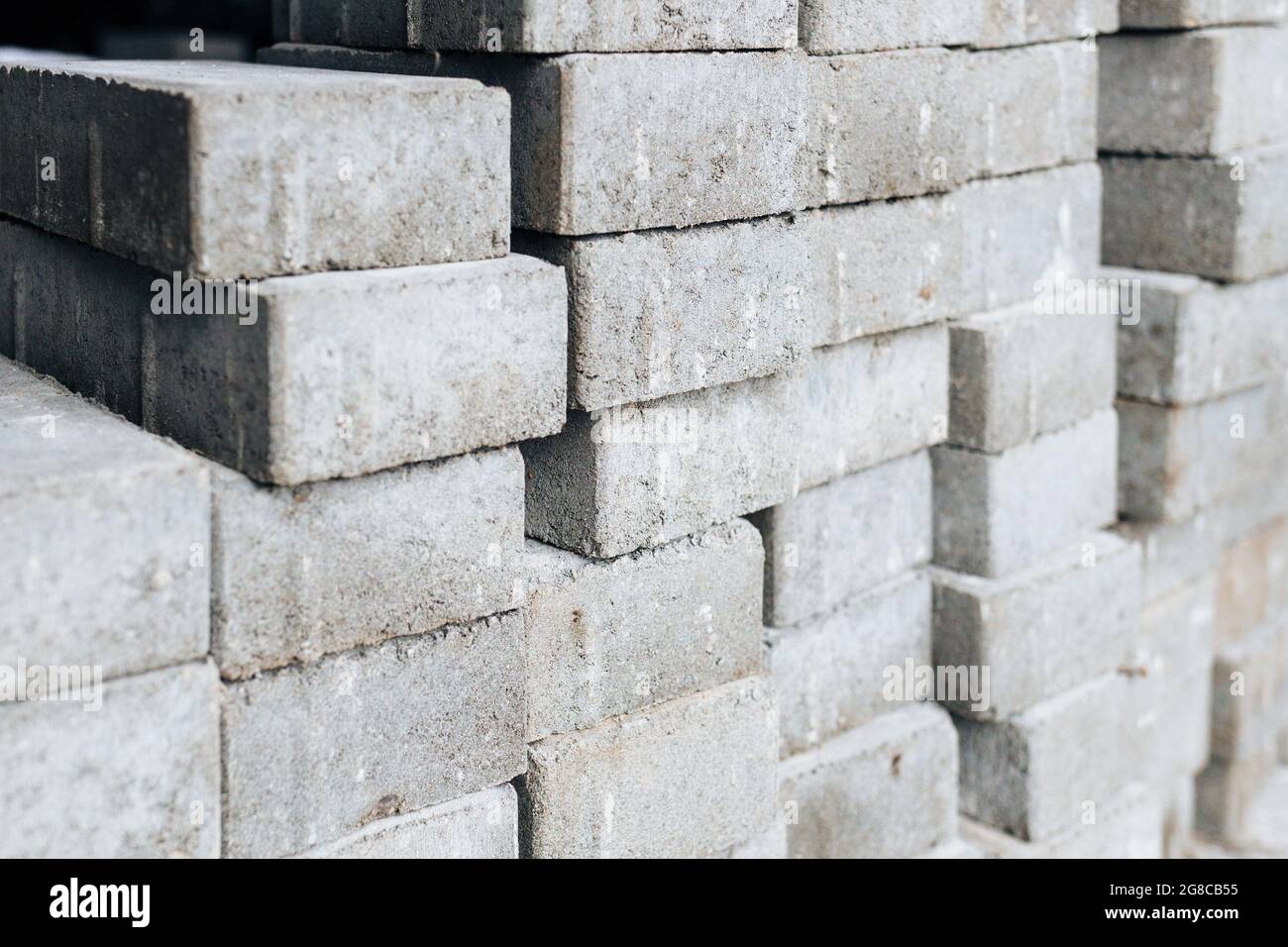 Les briques silicate grises sont empilées. Arrière-plan industriel. Concept  de construction Photo Stock - Alamy