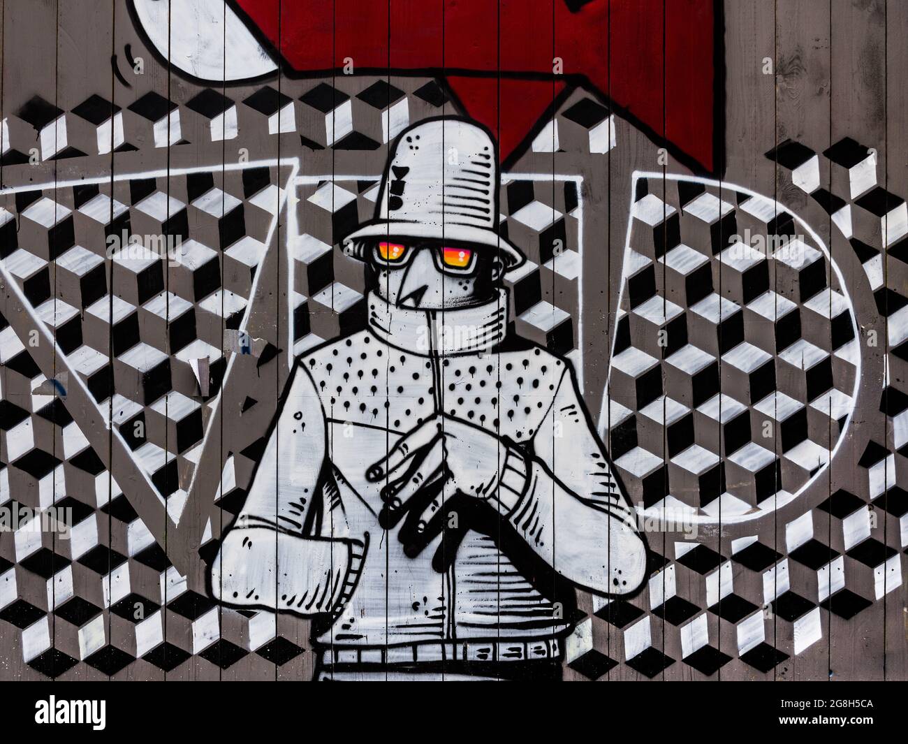 Murale monochrome de l'homme et fond à motifs sur le mur - Paris, France. Banque D'Images