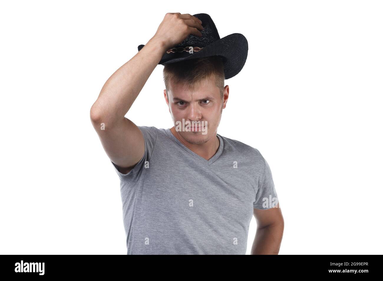 Photo d'un jeune piquant en chapeau de cowboy Banque D'Images