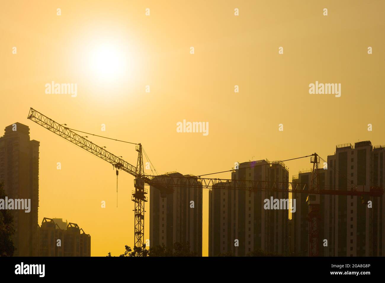 Chantier de construction à Hong Kong au coucher du soleil Banque D'Images