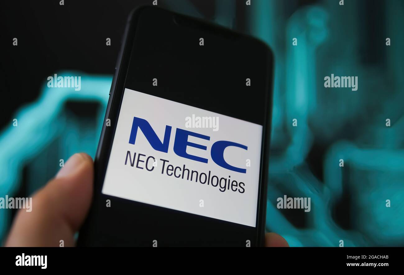 Viersen, Allemagne - mai 9. 2021: Gros plan de l'écran du téléphone avec le logo de nec corporation, bruit de fond du circuit de puissance flou Banque D'Images