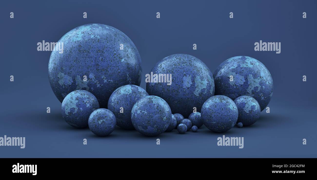 Boules géométriques de différentes tailles sur fond bleu Banque D'Images