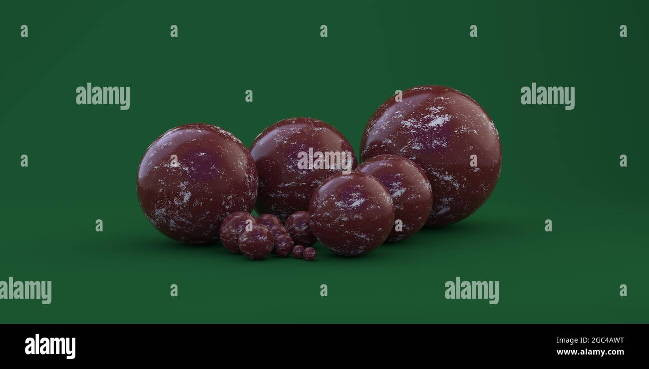 Boules géométriques de différentes tailles sur fond vert Banque D'Images