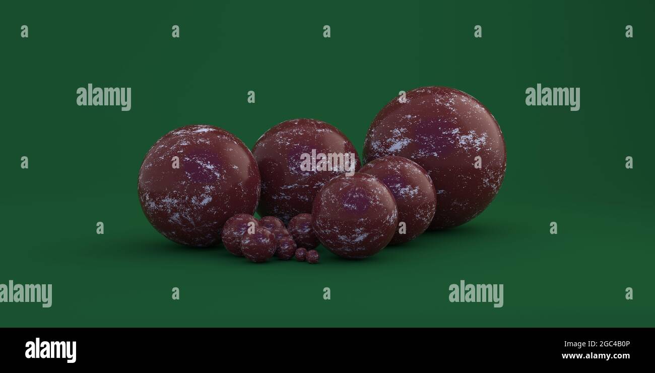 Boules géométriques de différentes tailles sur fond vert Banque D'Images