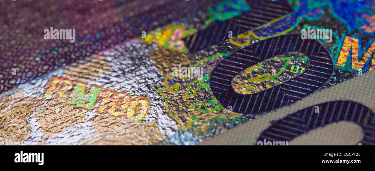 Une macro-photographie détaillée d'un vieux billet de banque de cent ringgit Malaisie. Près de 100 ringgit, la monnaie malaisienne. Photographie macro RM100. Banque D'Images