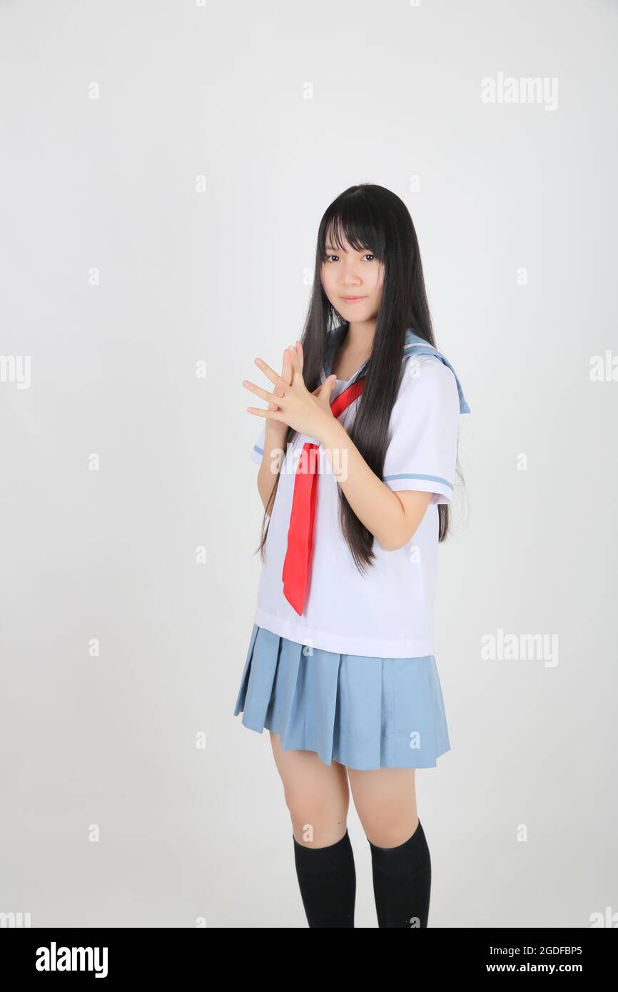 fille d'école asiatique isolée sur fond blanc Banque D'Images