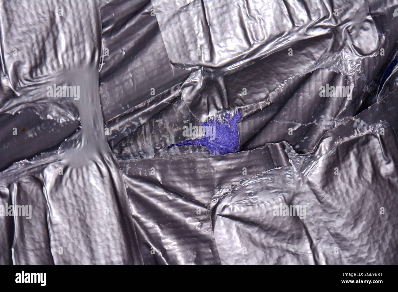 Fond de ruban adhésif argenté grundy. Banque D'Images