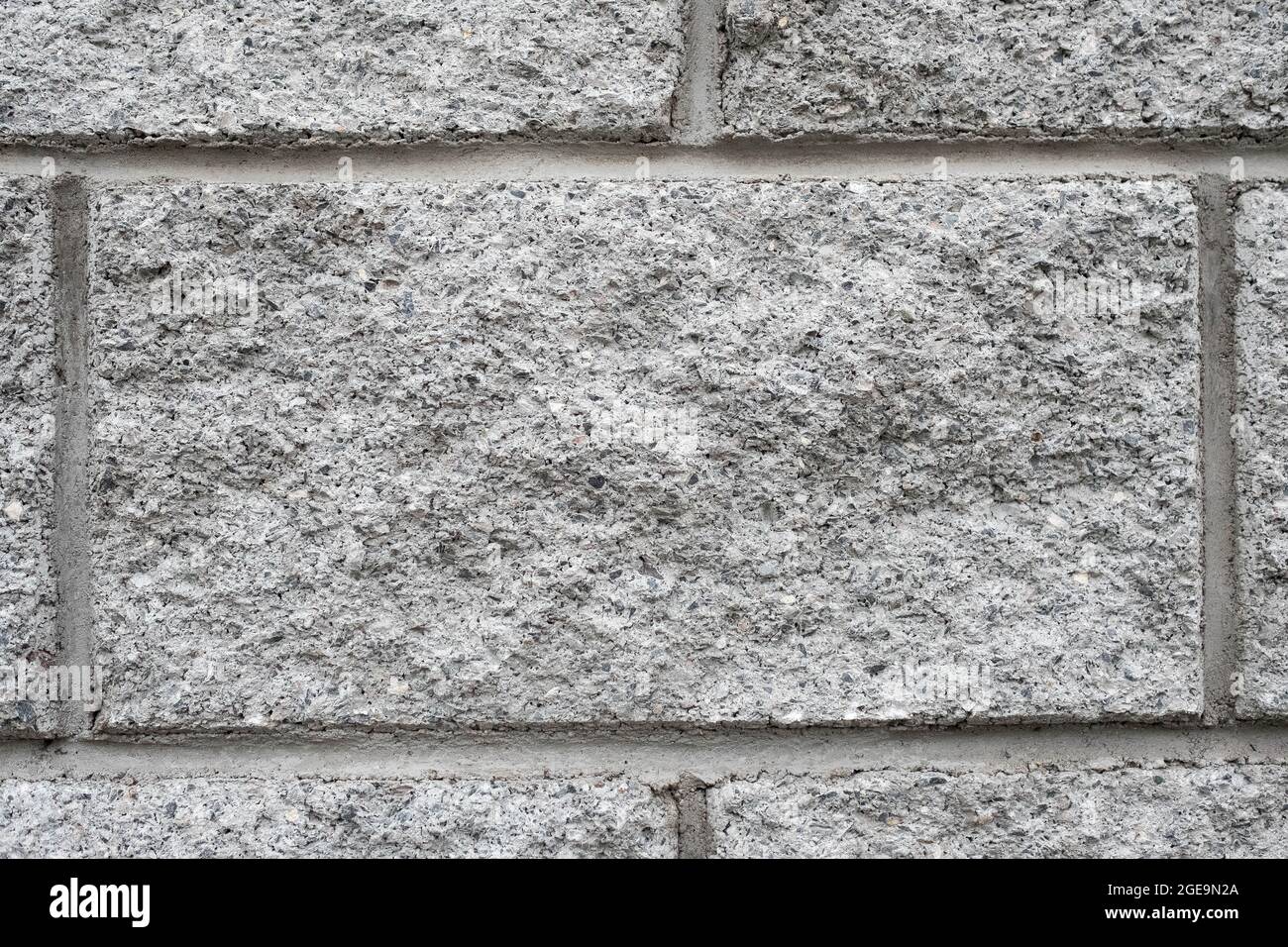 Une brique gaufrée grise. Mur de maçonnerie, arrière-plan. Banque D'Images