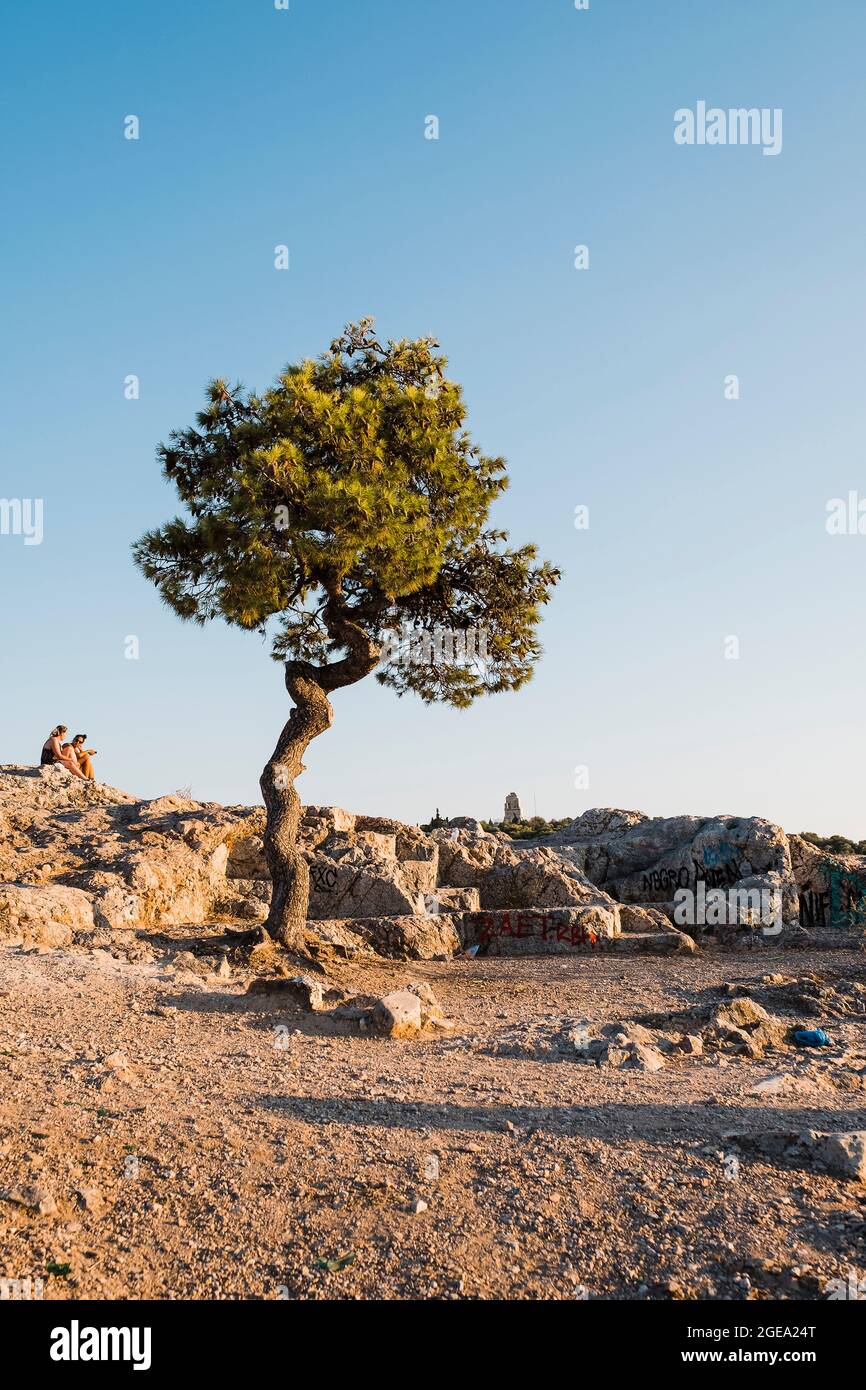 Coucher de soleil sur la colline de Filopappou. Banque D'Images