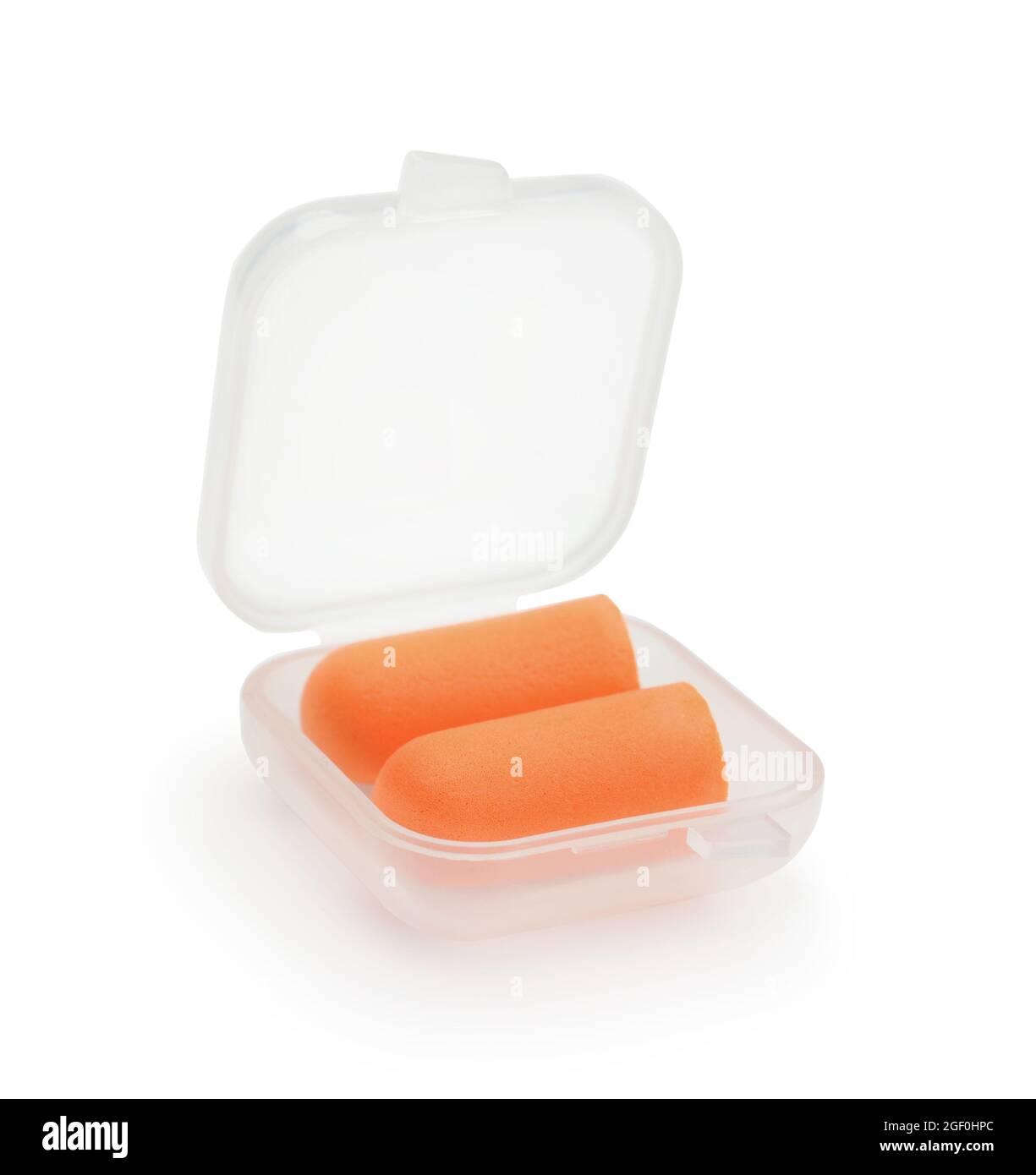 Une paire de bouchons d'oreilles orange dans une boîte en plastique isolée sur du blanc. Banque D'Images