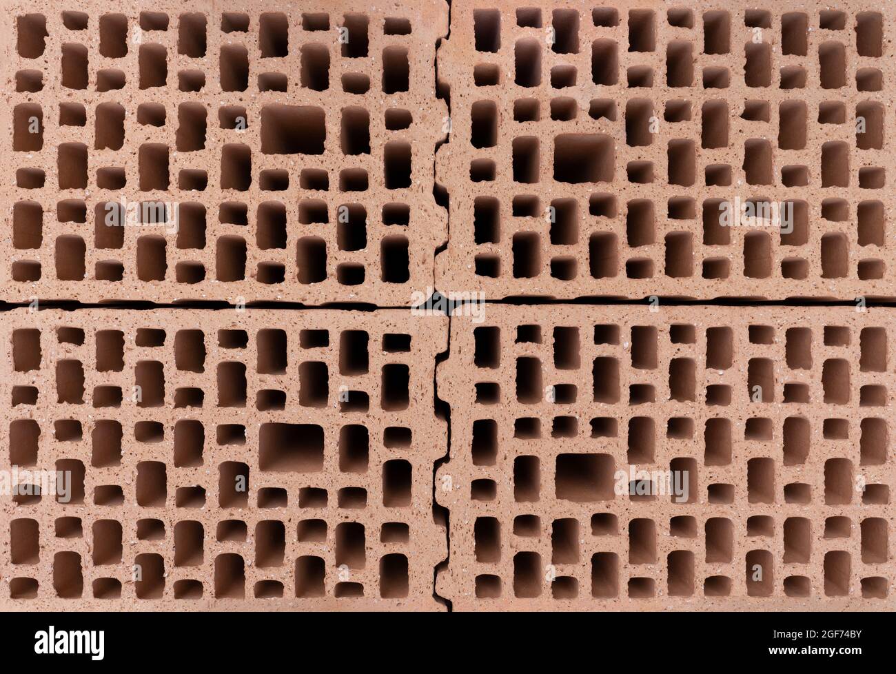 Structure du matériau à l'intérieur des briques rouges perforées Banque D'Images