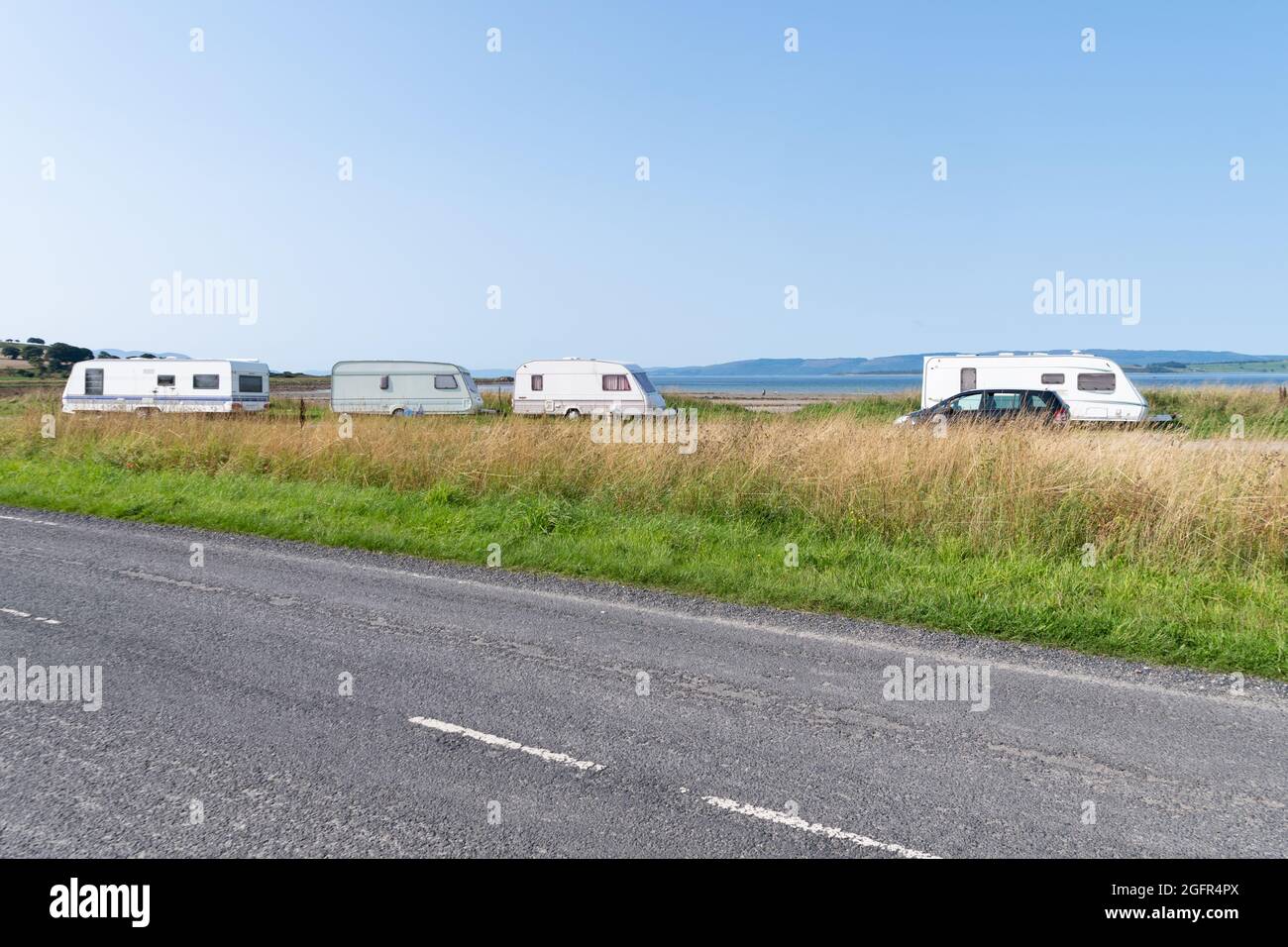 Caravanes mobiles garées à Ettrick Bay South, île de Bute, Écosse, Royaume-Uni Banque D'Images