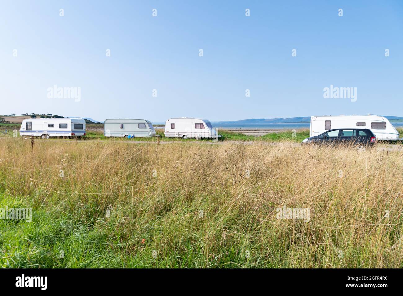 Caravanes mobiles garées à Ettrick Bay South, île de Bute, Écosse, Royaume-Uni Banque D'Images
