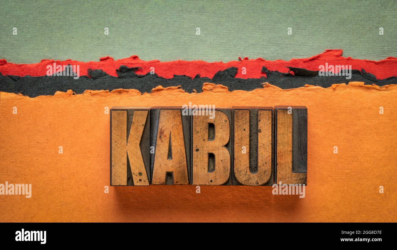 Kaboul mot résumé en typographie vintage type bois blocs d'impression contre papier abstrait paysage désertique dans les tons rouge, orange et noir Banque D'Images