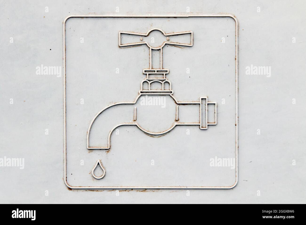 Symbole du robinet d'eau sur un couvercle en plastique Banque D'Images