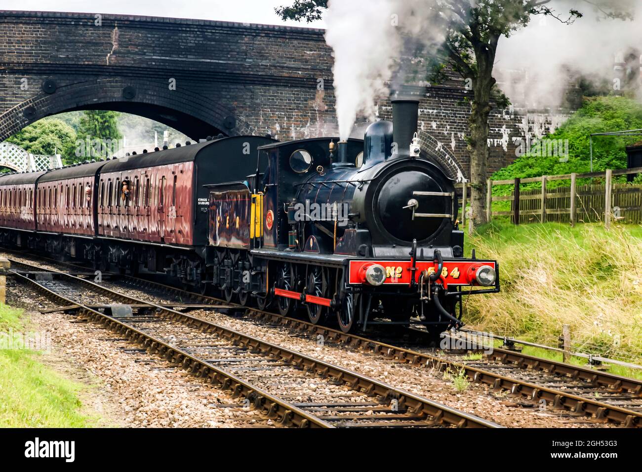 Great Eastern Railway 0-6-0 no 564 départ de la gare de Weybourne avec un train jusqu'à l'arrêt Banque D'Images