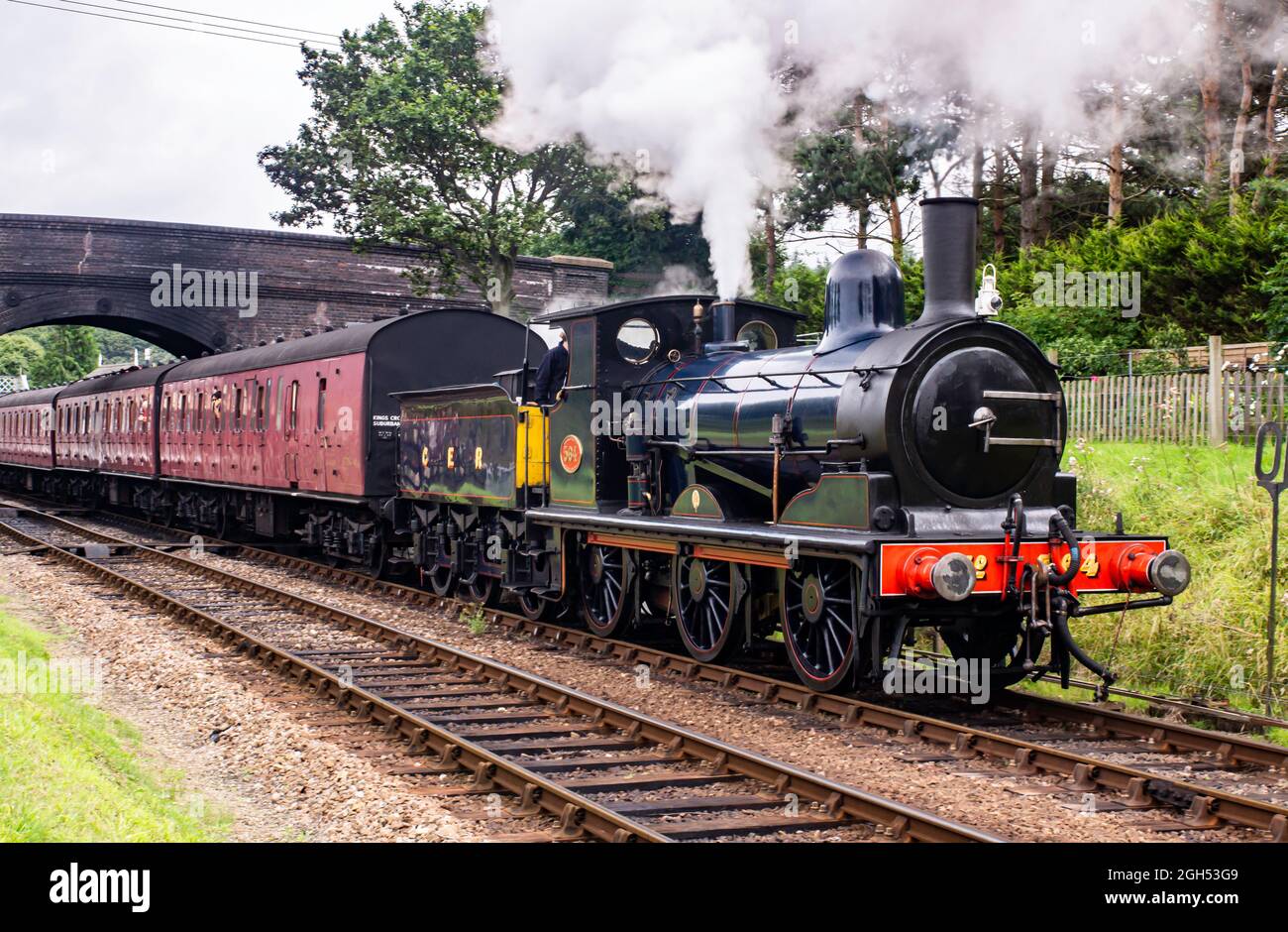 Great Eastern Railway 0-6-0 no 564 départ de la gare de Weybourne avec un train jusqu'à l'arrêt Banque D'Images