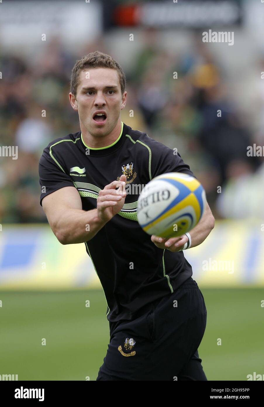 George North of Northampton Saints se réchauffe avant le lancement de l'Aviva Premiership aux Northampton Saints and Exeter Chiefs aux Franklin's Gardens de Northampton le 7 septembre 2013. Banque D'Images