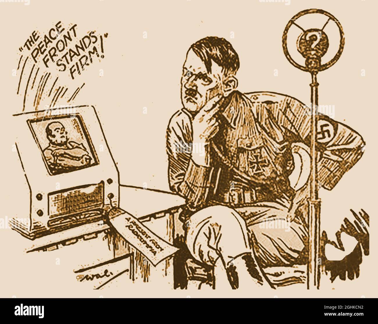 Nouvelles du monde Hitler Cartoon août 27 1939 (quatre jours avant le début de la Seconde Guerre mondiale. Le téléviseur porte une étiquette indiquant « Un cadeau de Radiolympia ». Radiolympia, alias radio Show, était une exposition pionnière de matériel radiophonique et plus tard télévisuel, qui s'est tenue chaque année à Olympia à Londres, en Angleterre. La première émission de télévision haute définition a été réalisée lors d'un test par la BBC à partir de l'exposition du 26 août 1936, la veille de l'apparition de la bande dessinée dans le journal. Banque D'Images