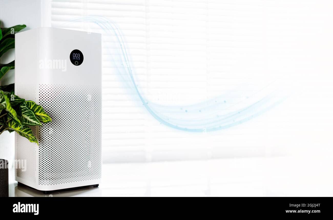 Purificateur d'air un salon, filtre à air enlever la poussière fine dans la maison. Protéger PM 2.5 poussière et pollution de l'air concept Banque D'Images