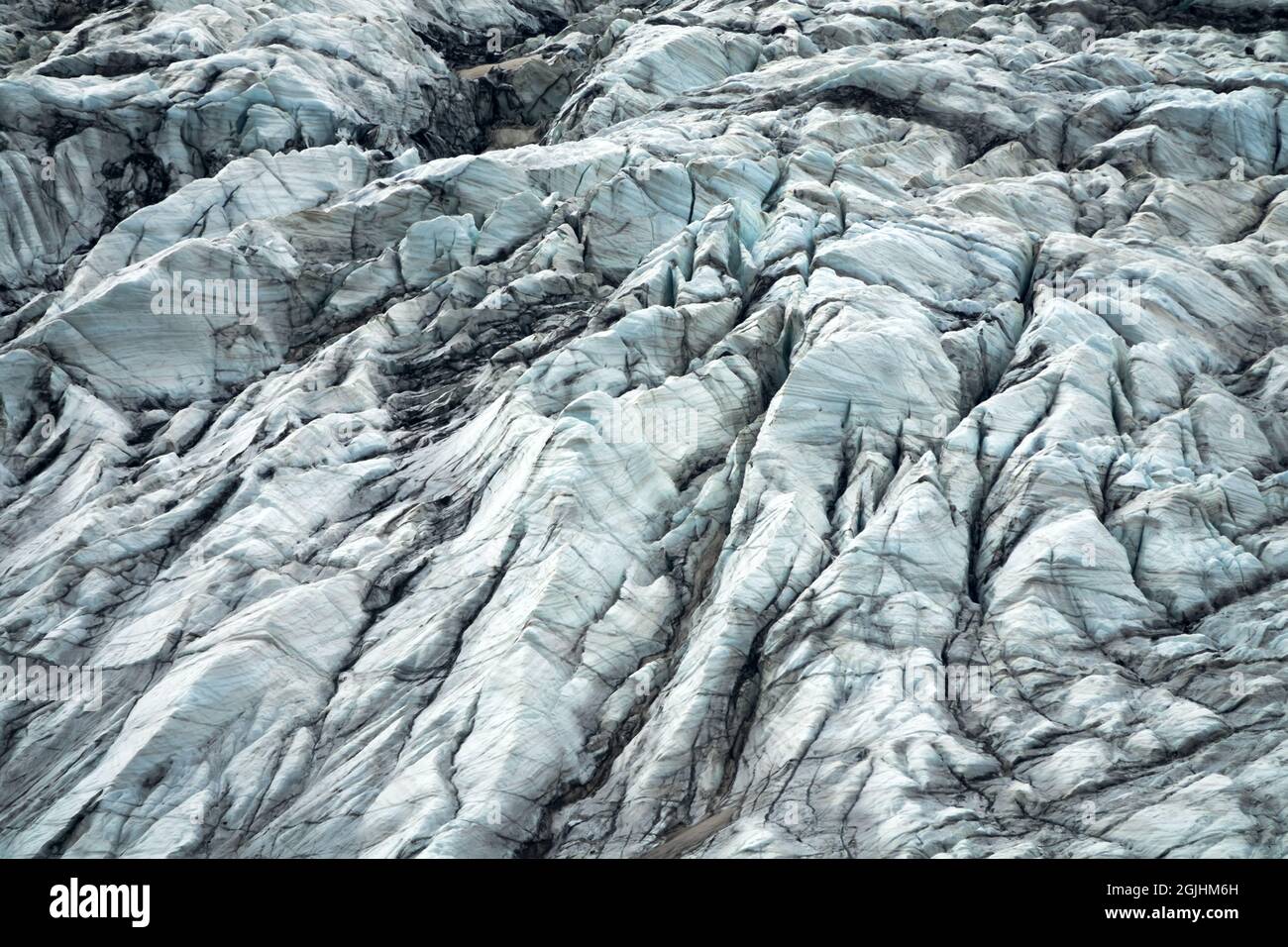 Glaciologie. Montagne (alpine) glacier. Surface des glaciers - dépôt de glace et stries de tapis Banque D'Images