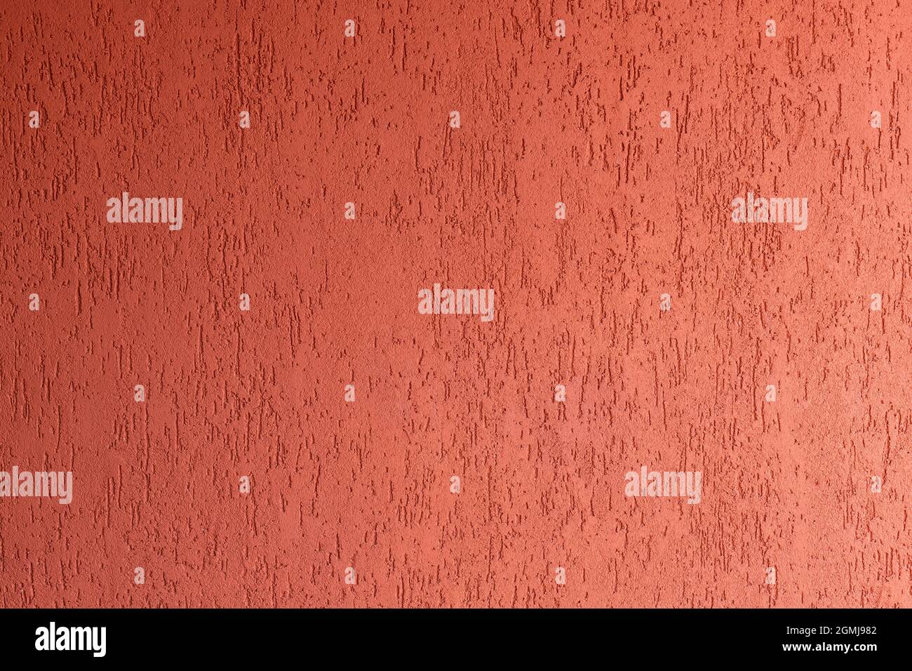 Surface du mur avec plâtre rouge décoratif Banque D'Images