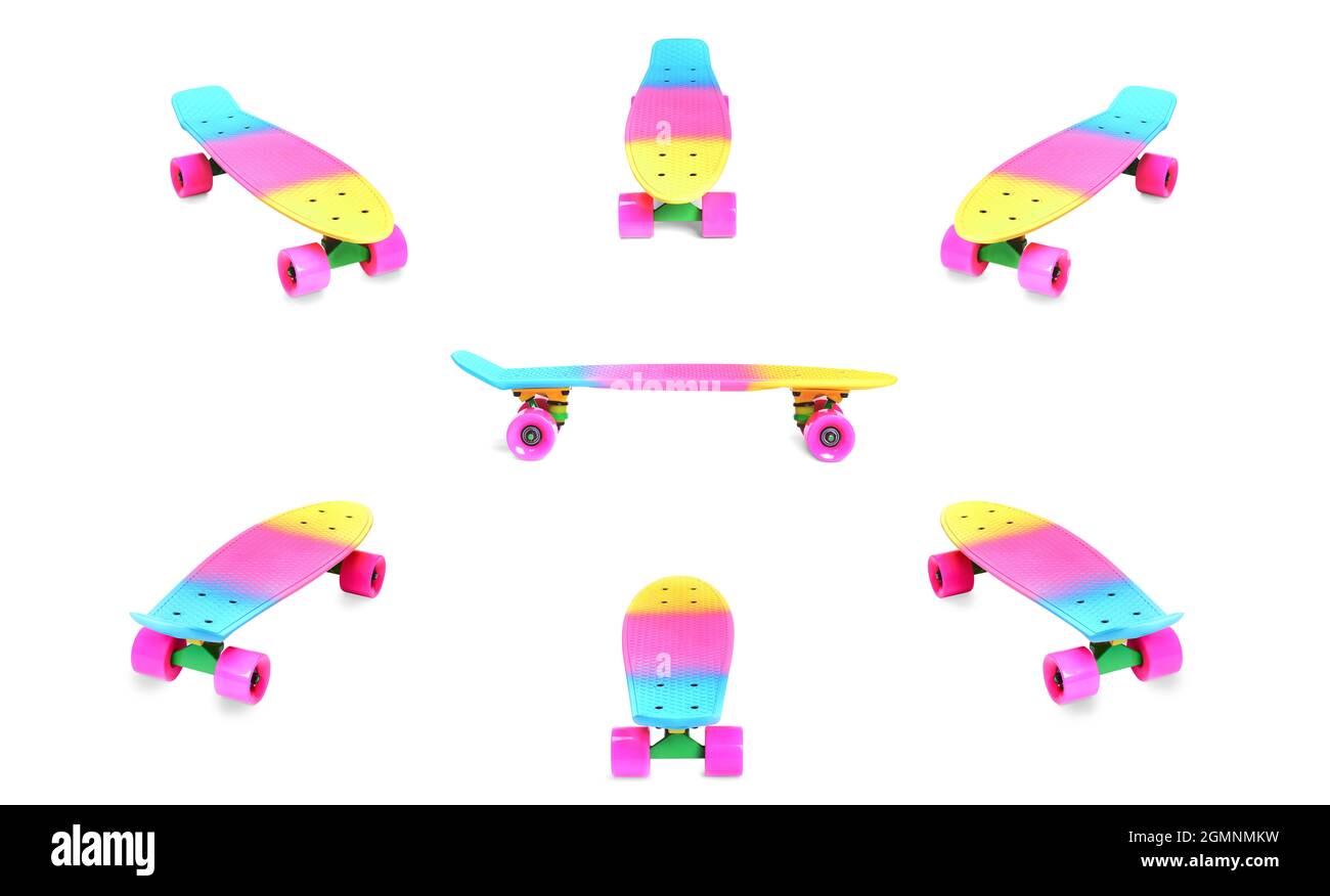 Ensemble de planche à roulettes en plastique arc-en-ciel Penny, isolée sur du blanc Banque D'Images