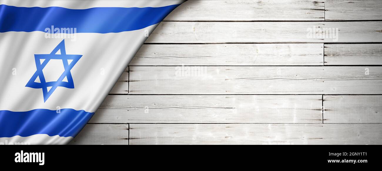 Drapeau israélien sur l'ancien mur blanc. Bannière panoramique horizontale. Banque D'Images