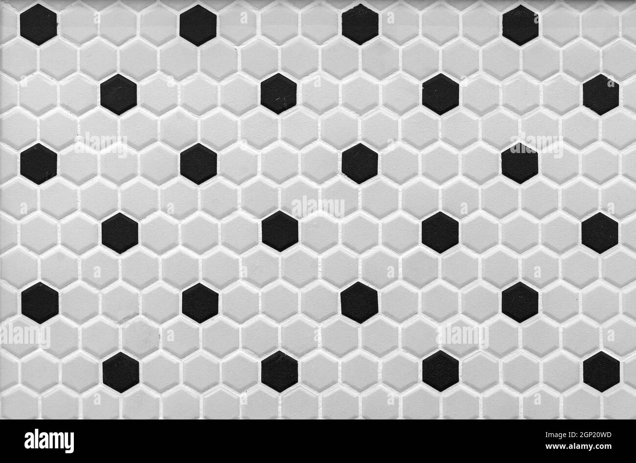 Carreaux de mosaïque en céramique gris-noir en forme de nid d'abeille. Banque D'Images