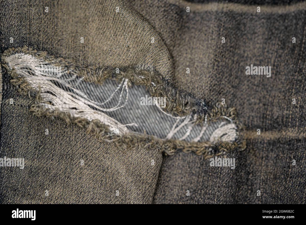 Gros plan photos de la surface du tissu Old Jeans et de la marque de  déchirure Photo Stock - Alamy