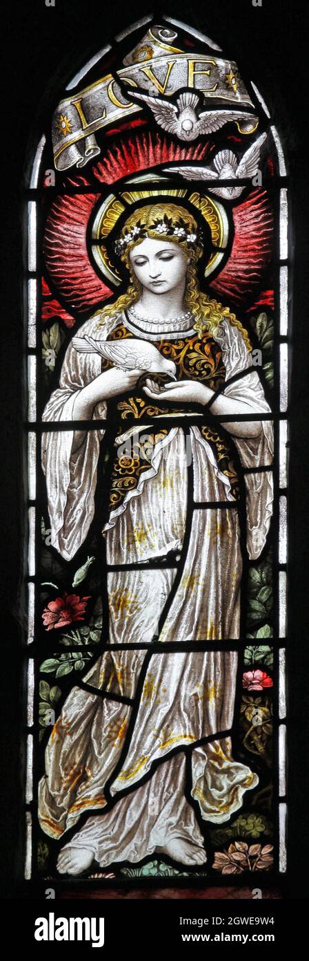 Une fenêtre en vitraux de Heaton Butler & Bayne représentant l'Amour, l'église St James' Church, Newbottle, Northamptonshire Banque D'Images