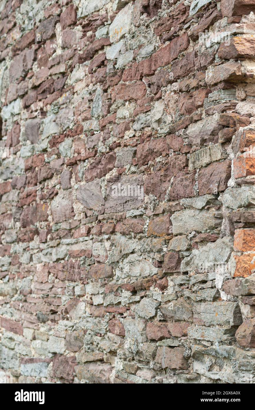 mur de pierre rouge. fragment d'un ancien château Banque D'Images