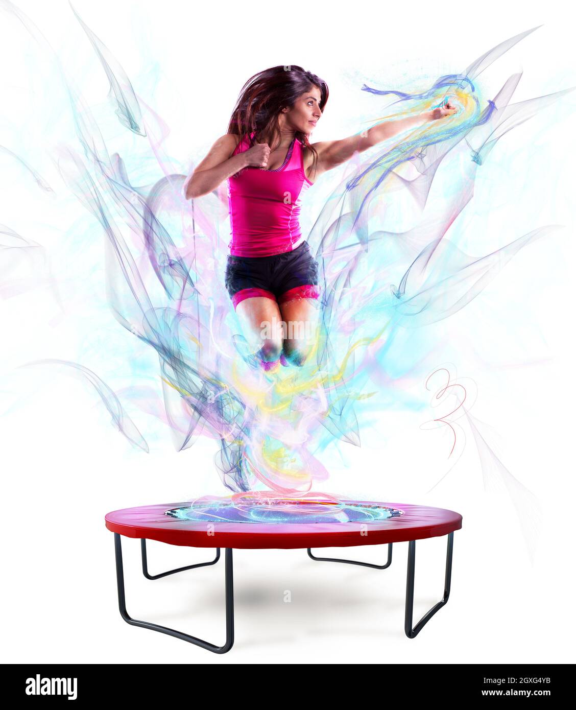 Un professeur de fitness saute avec agilité sur le trampoline avec un effet  de lumière de couleur Photo Stock - Alamy