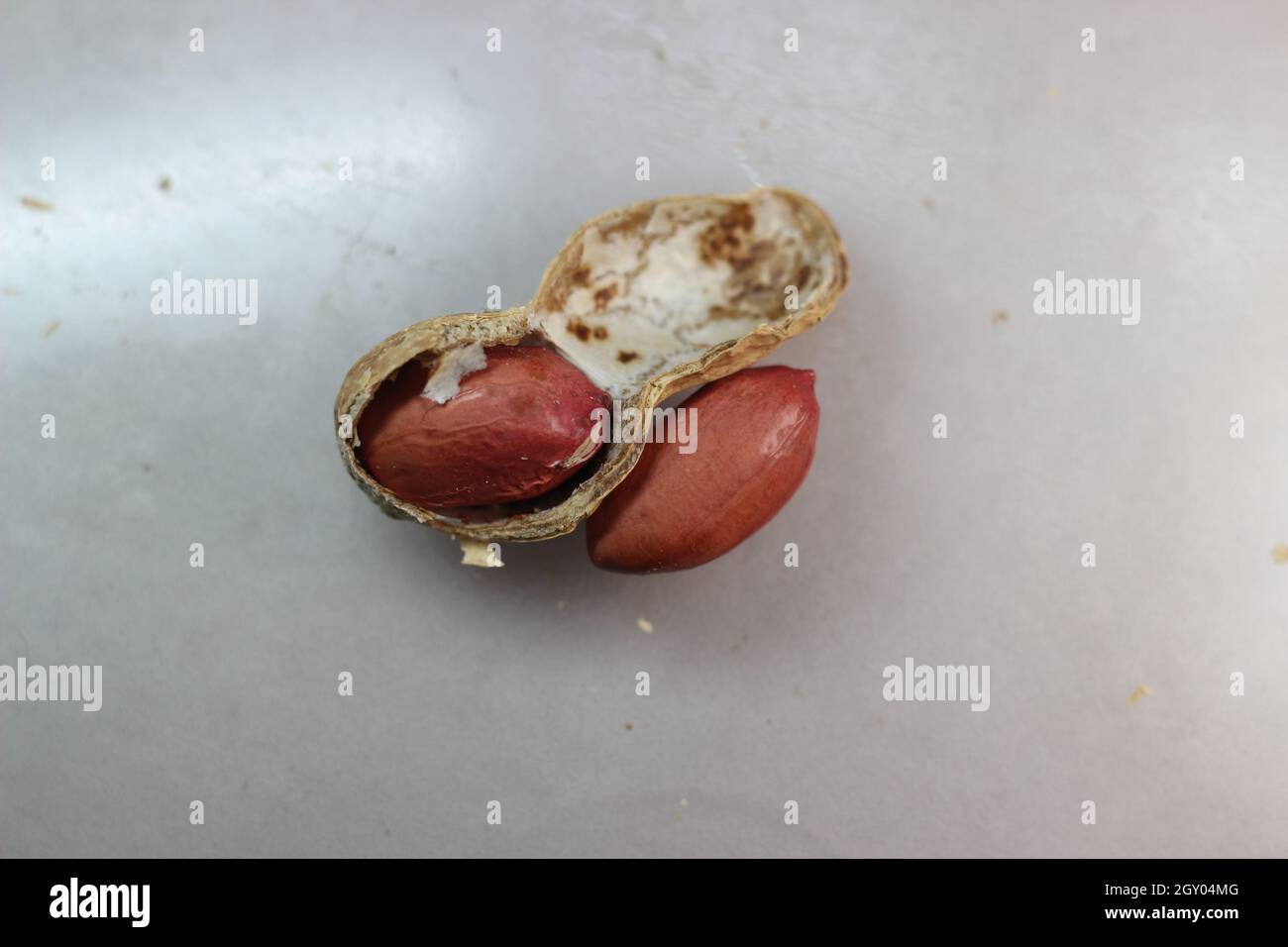 Arachides non pelées avec coquilles.Fond alimentaire des arachides Banque D'Images