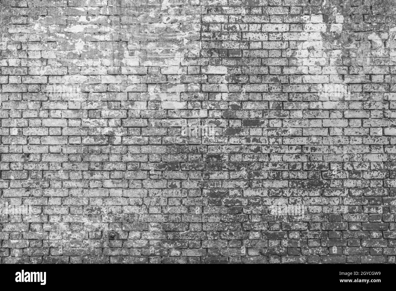Vieux ruiné briques mur arrière-plan en noir et blanc. Ruineux mur épave texture pour tapisserie et papier peint.Copier l'espace sur un mur de briques.arrière-plan 3d. Banque D'Images