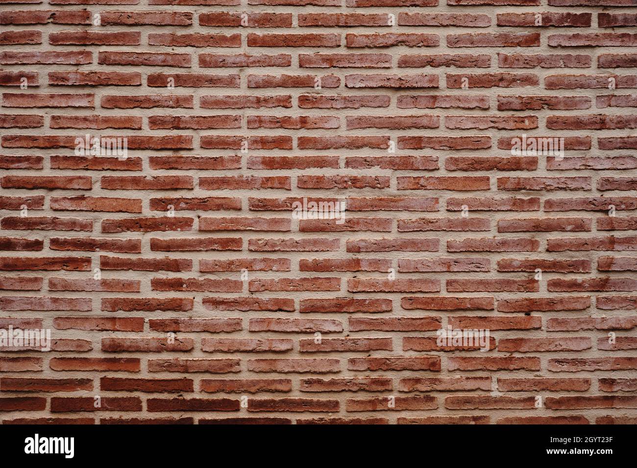 Le mur de briques exposé grunge l'arrière-plan ou la texture Banque D'Images