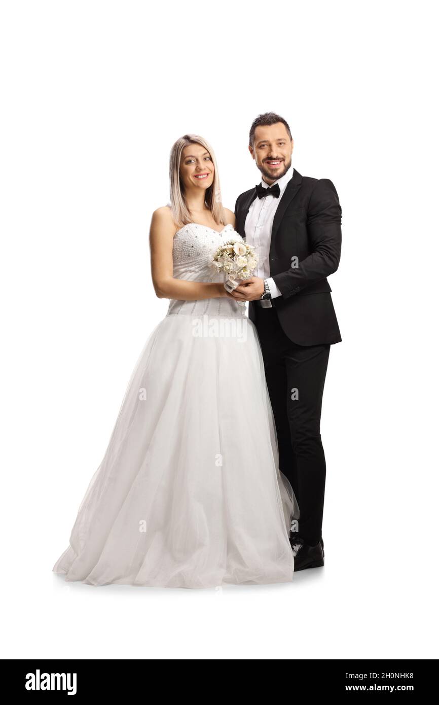 Portrait complet d'une mariée et d'un marié heureux isolés sur fond blanc Banque D'Images