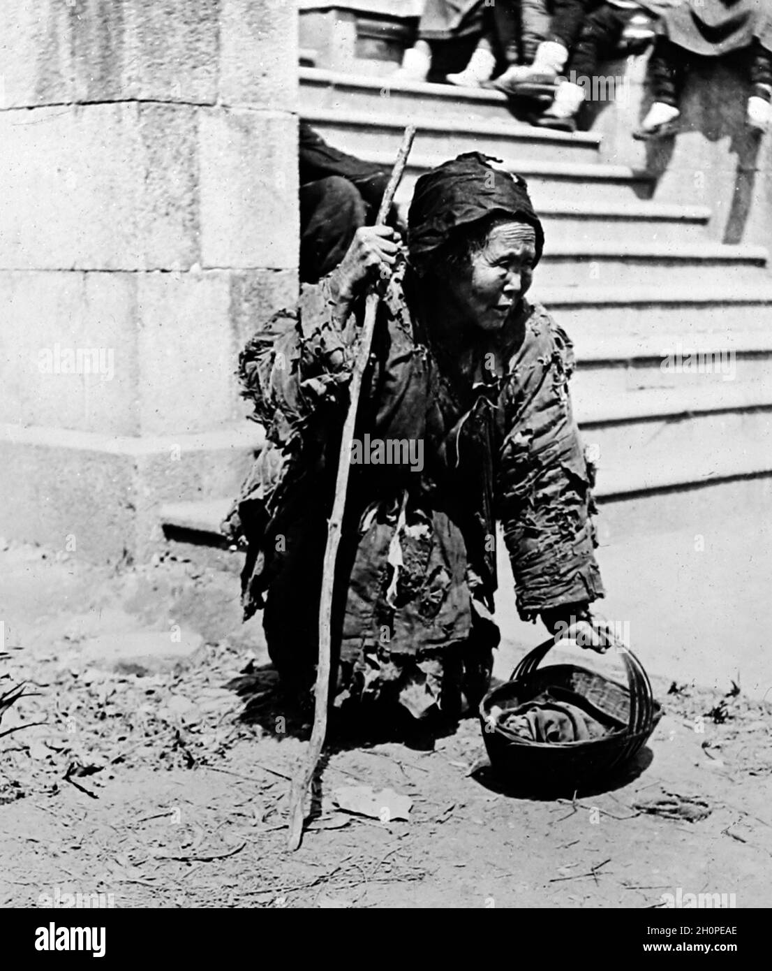 Street Beggar, Chine, époque victorienne Banque D'Images