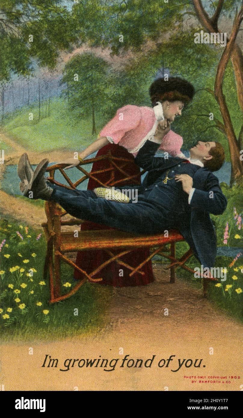 'Je suis de plus en plus affectueux de vous': Carte postale Edwardian Bamforth Comic Series, datée de 1909, numéro 1472 Banque D'Images