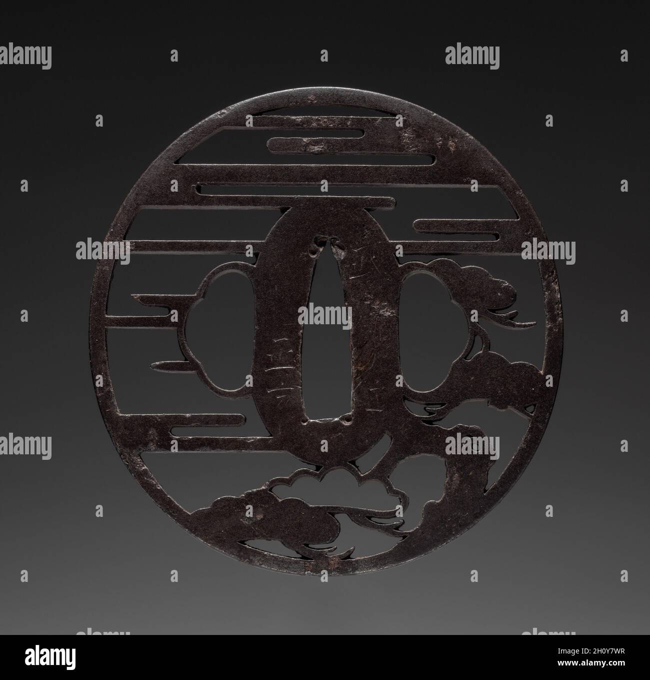 Garde au sabre, début des années 1800.Masakata (japonais).Fer (type Ito); diamètre : 7 cm (2 3/4 po). Banque D'Images