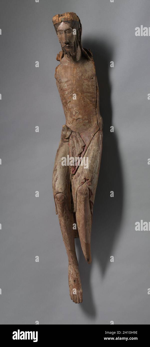 Corpus d'un Crucifix, c.1130-1140.France, Bourgogne, Autun?, XIIe siècle.Bois polychromé; hors tout: 111.1 x 20.2 x 7.8 cm (43 3/4 x 7 15/16 x 3 1/16 po). Banque D'Images