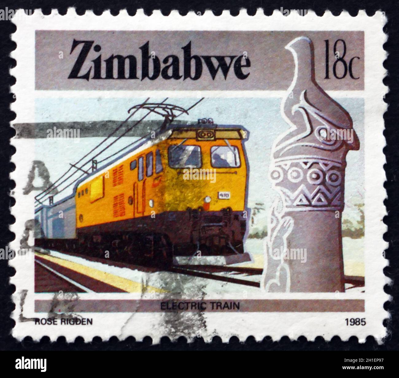 ZIMBABWE - VERS 1985: Un timbre imprimé au Zimbabwe montre le Zimbabwe oiseau et train électrique, vers 1985 Banque D'Images