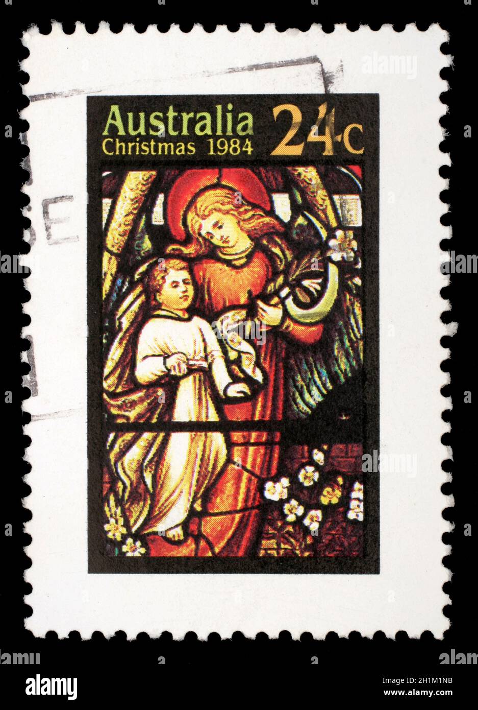 Le timbre de Noël imprimé en Australie montre Angel avec enfant, vers 1984 Banque D'Images